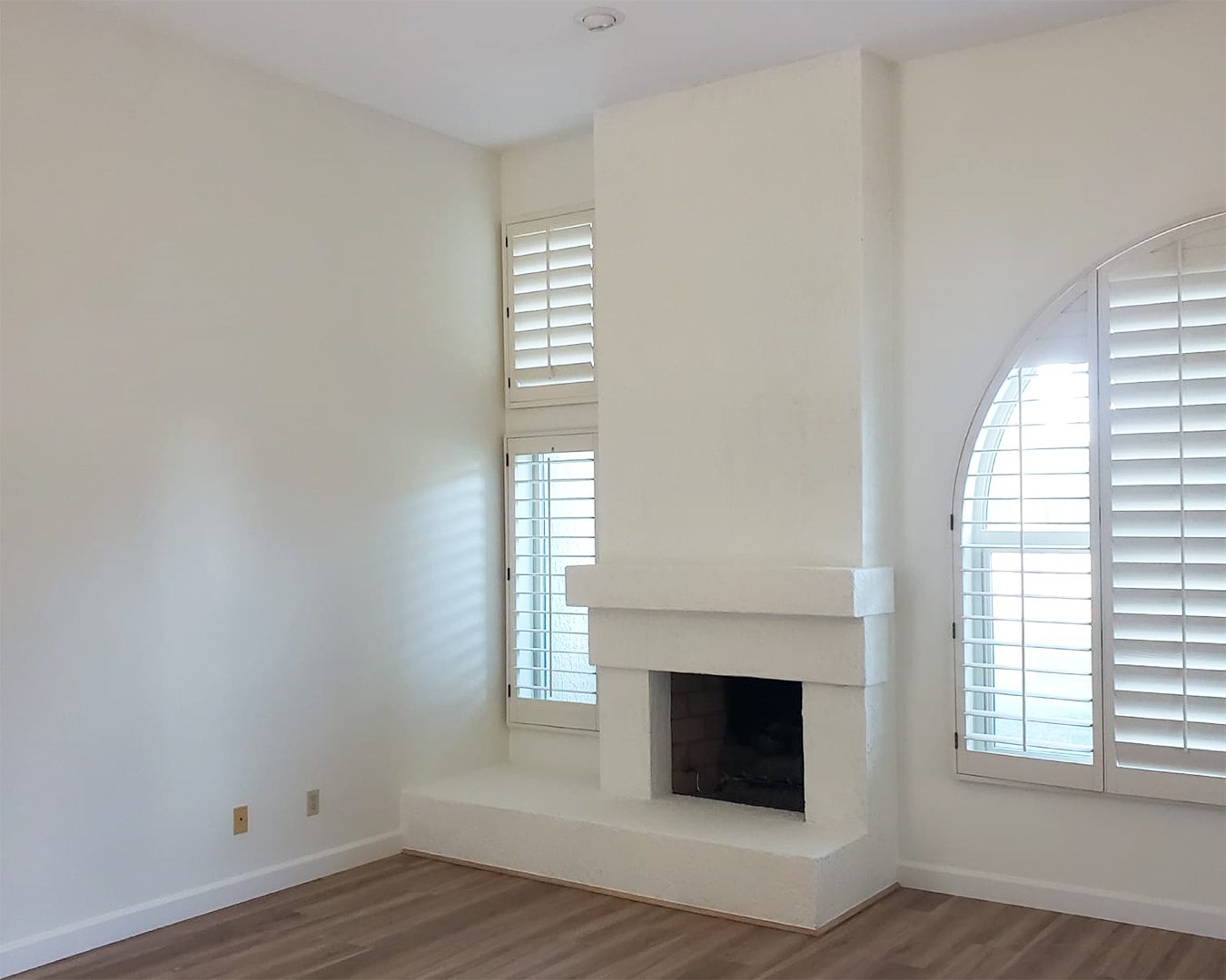 Painted white living room and fireplace