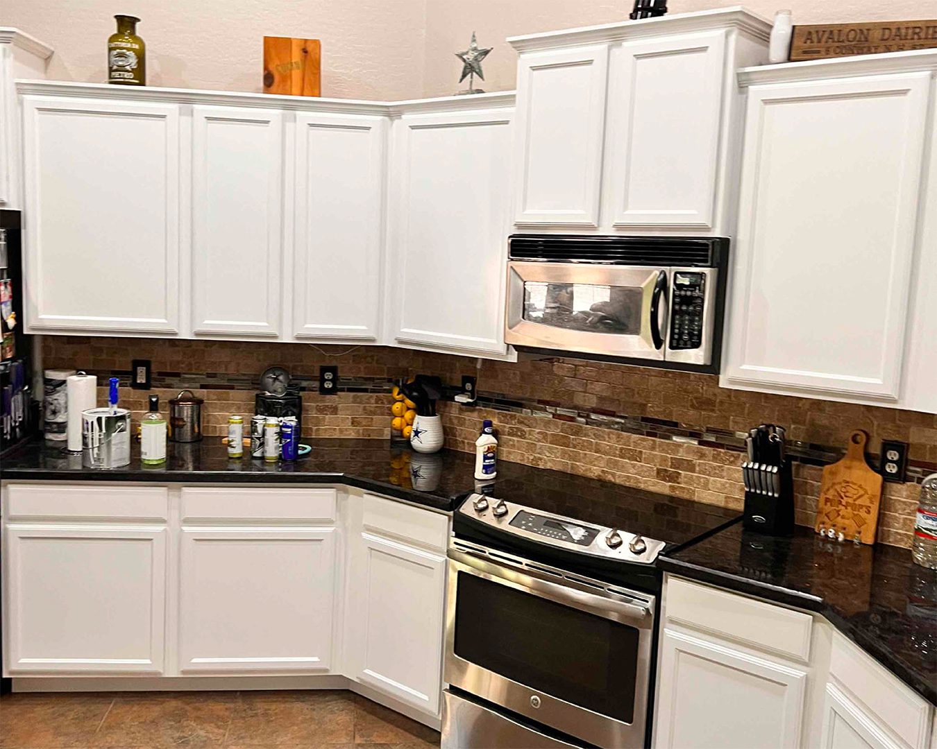 Painted white cabinets in kitchen in Casa Grande home