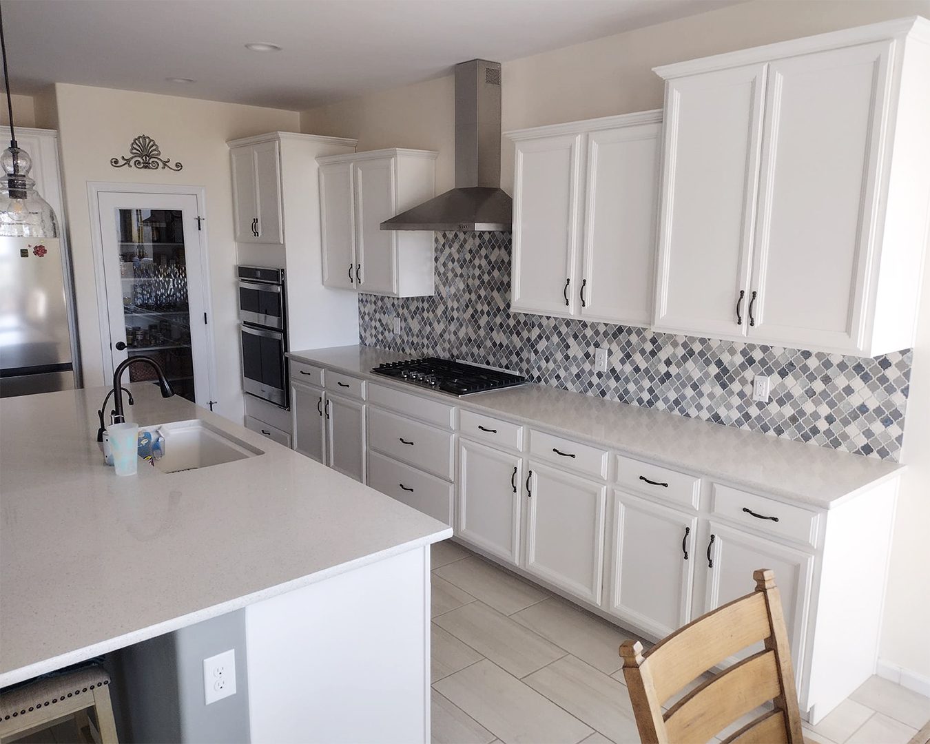 Painted white cabinets in kitchen of Marana, AZ home