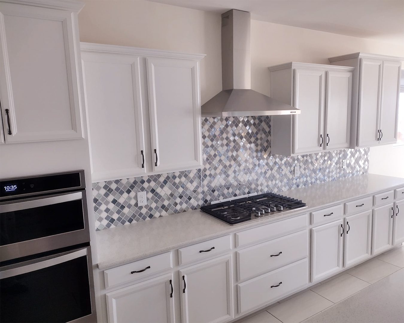 Painted white cabinets in kitchen of Marana, AZ home