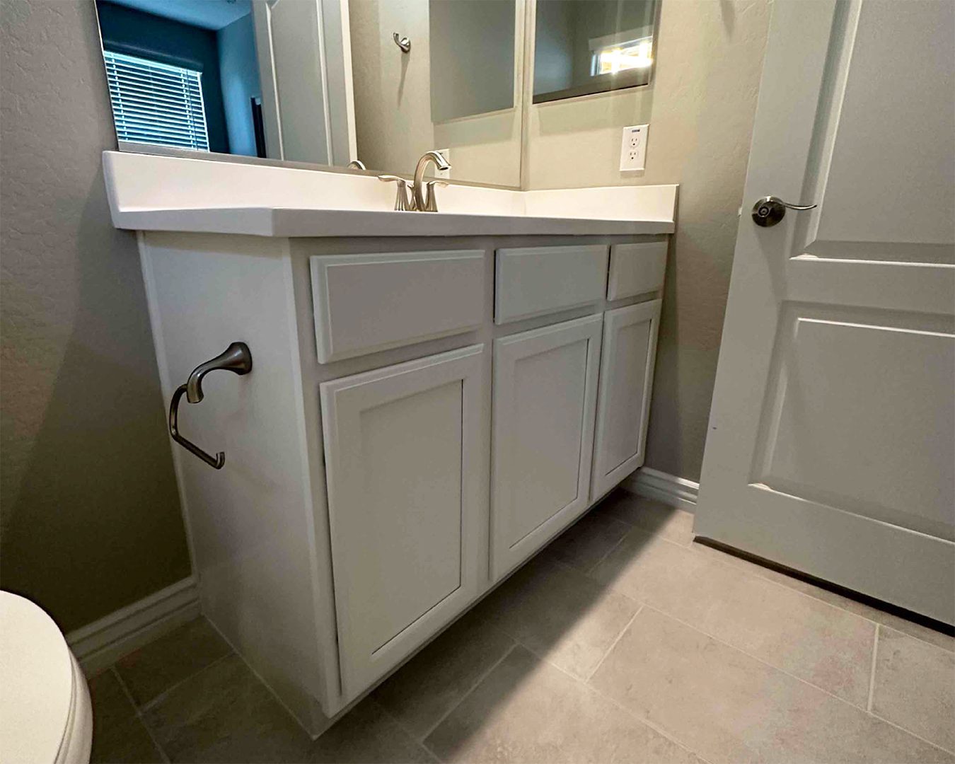 Painted cabinets inside Surprise, AZ bathroom