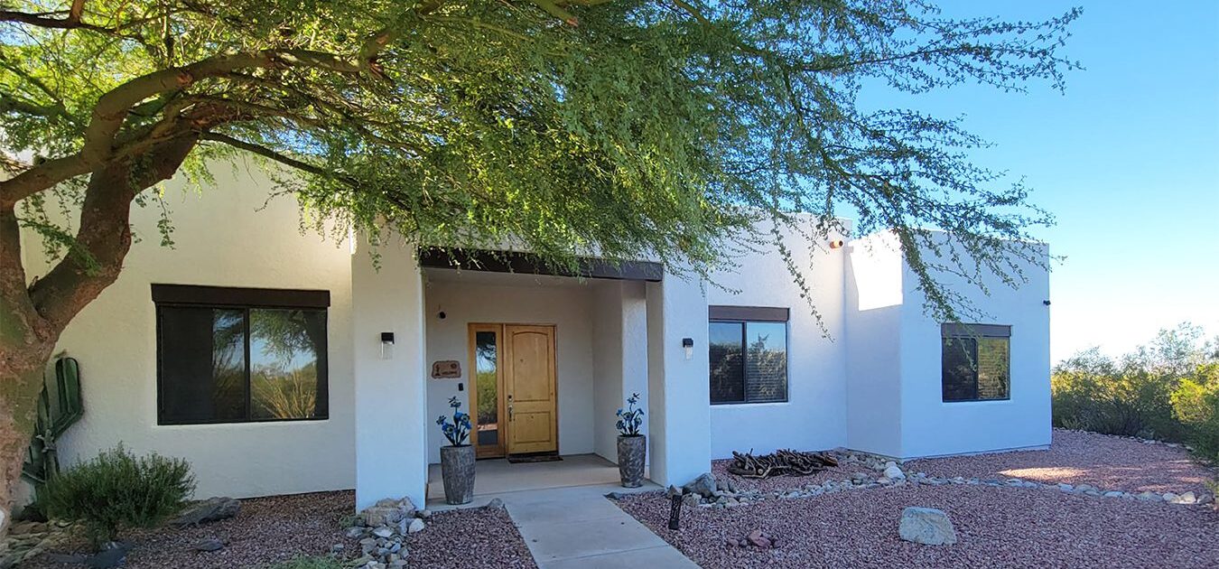 Painted off-white exterior of an Arizona desert home