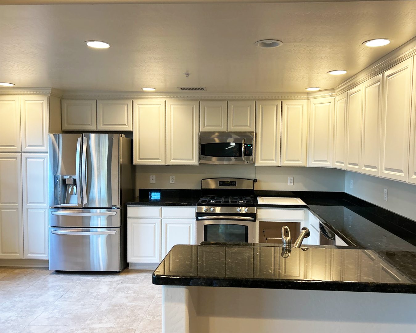 Painted white cabinets in kitchen