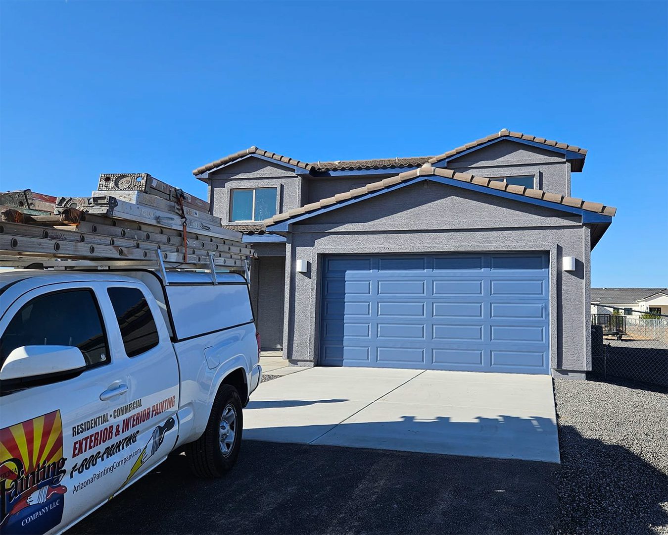 Painted exterior of home including garage door