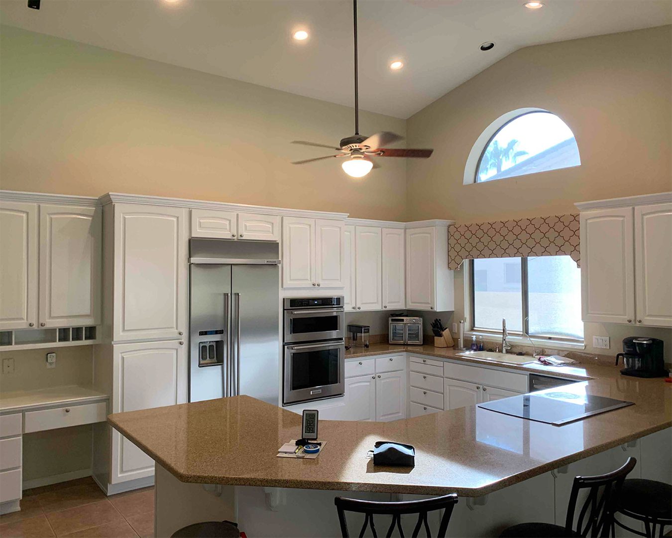 Painted white cabinets in kitchen of Goodyear home