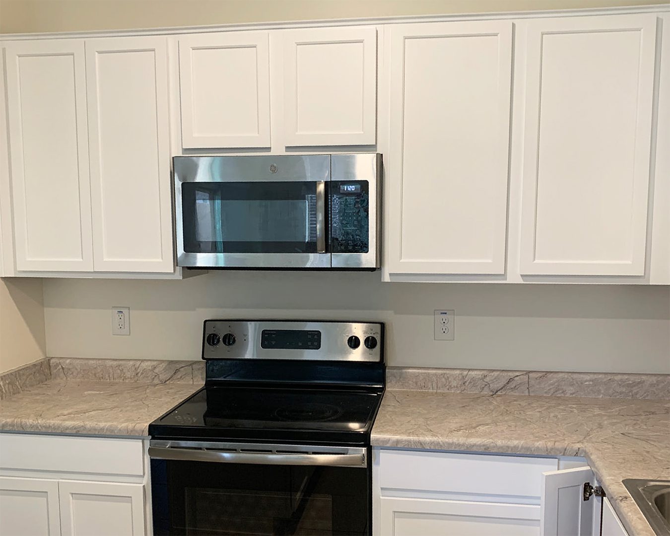 Painted white cabinets in kitchen of Laveen, AZ home