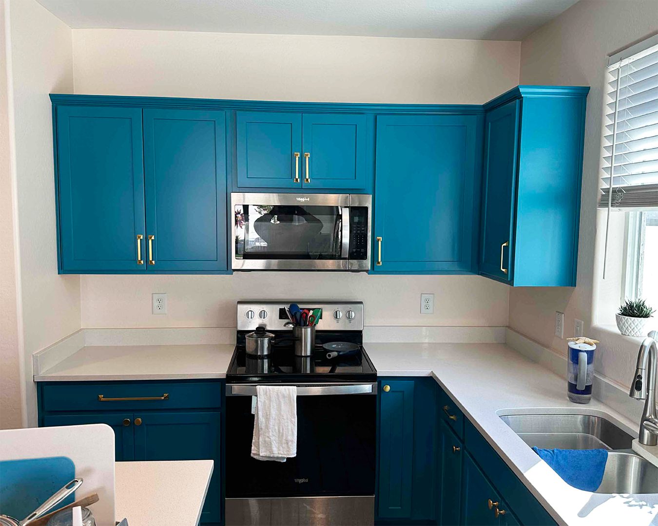 Painted blue cabinets in kitchen of Laveen, AZ home