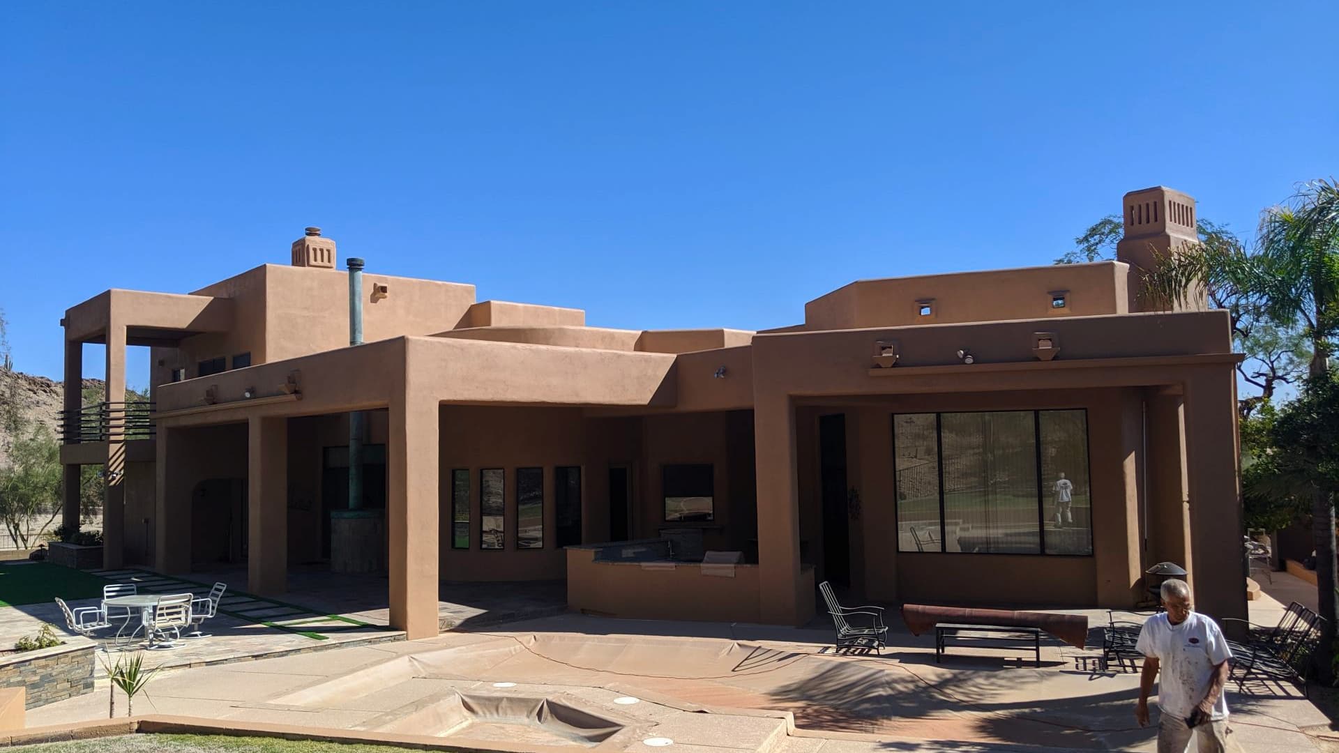 Brown home transformed by Arizona Painting Company: A beautifully painted residential exterior, showcasing a rich and inviting color, exemplifying the skillful craftsmanship and dedication of Arizona Painting Company.