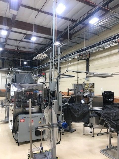 Arizona Painting Company's skilled industrial painters providing durable protective coatings for machinery and structures, enhancing both longevity and aesthetics. Industrial grey machinery before being painted.