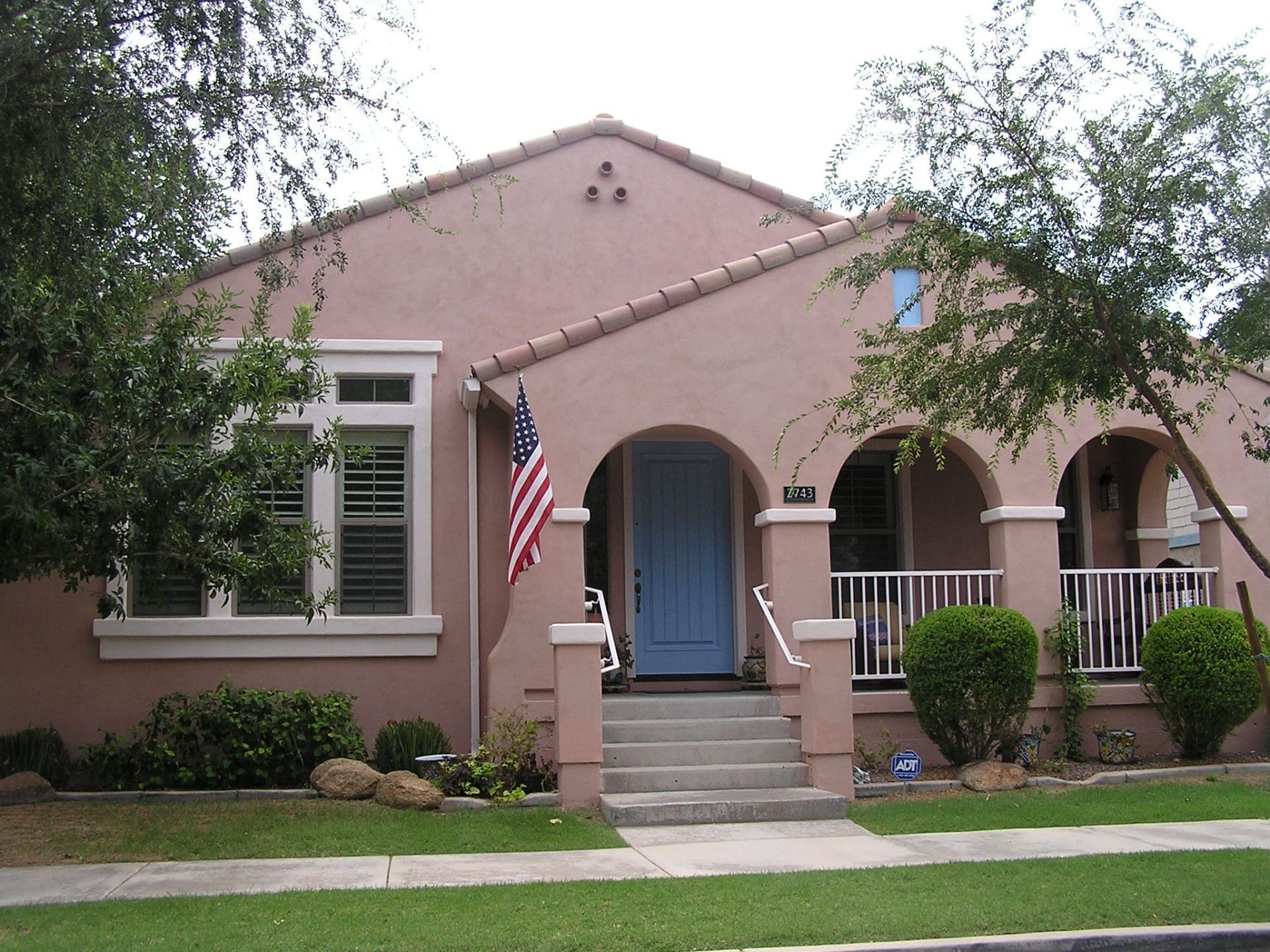 Residential exterior transformed by Arizona Painting Company: A newly painted brown home, displaying their expert craftsmanship and attention to detail.
