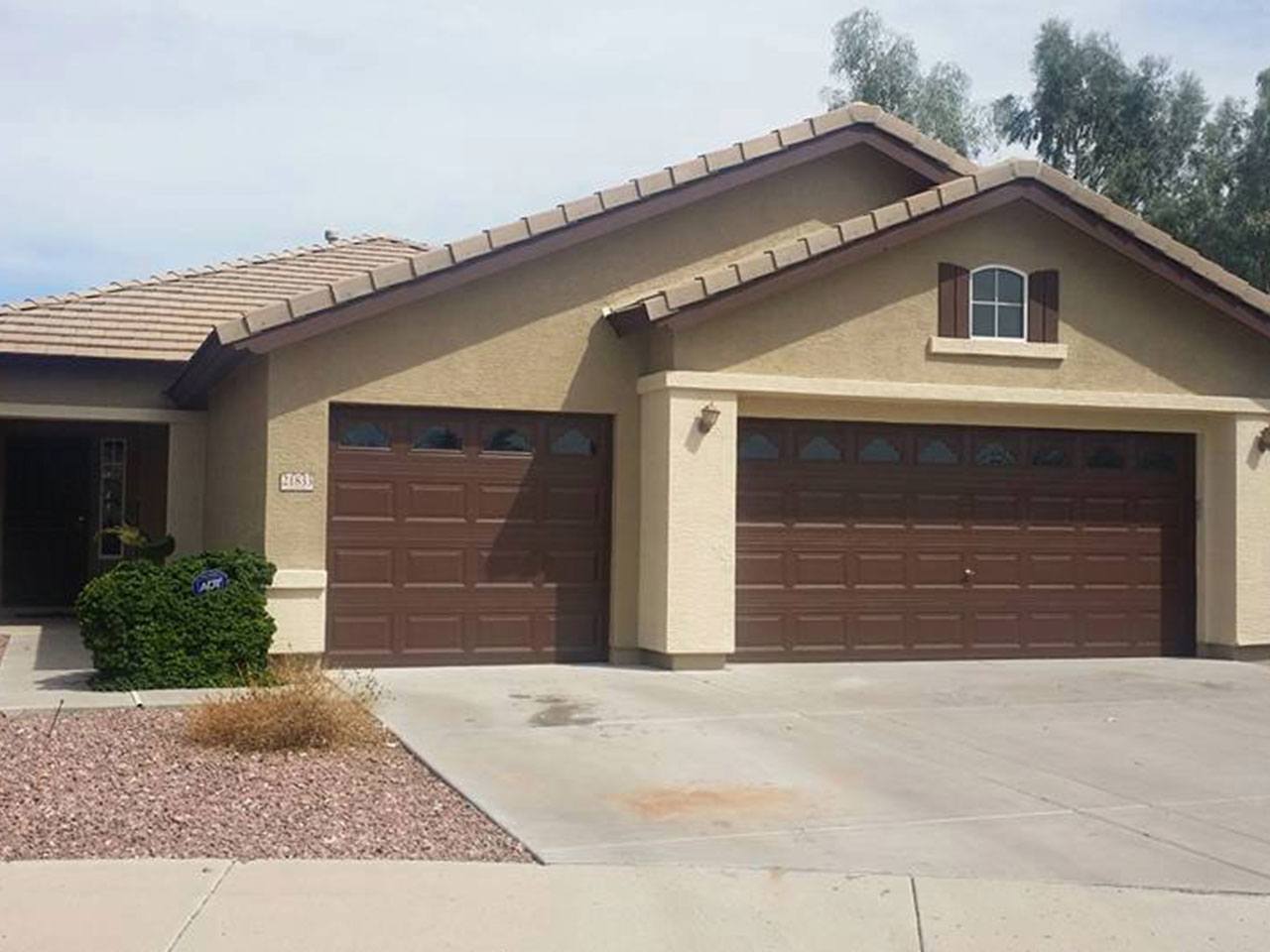 Residential exterior transformed by Arizona Painting Company: A newly painted brown home, displaying their expert craftsmanship and attention to detail.