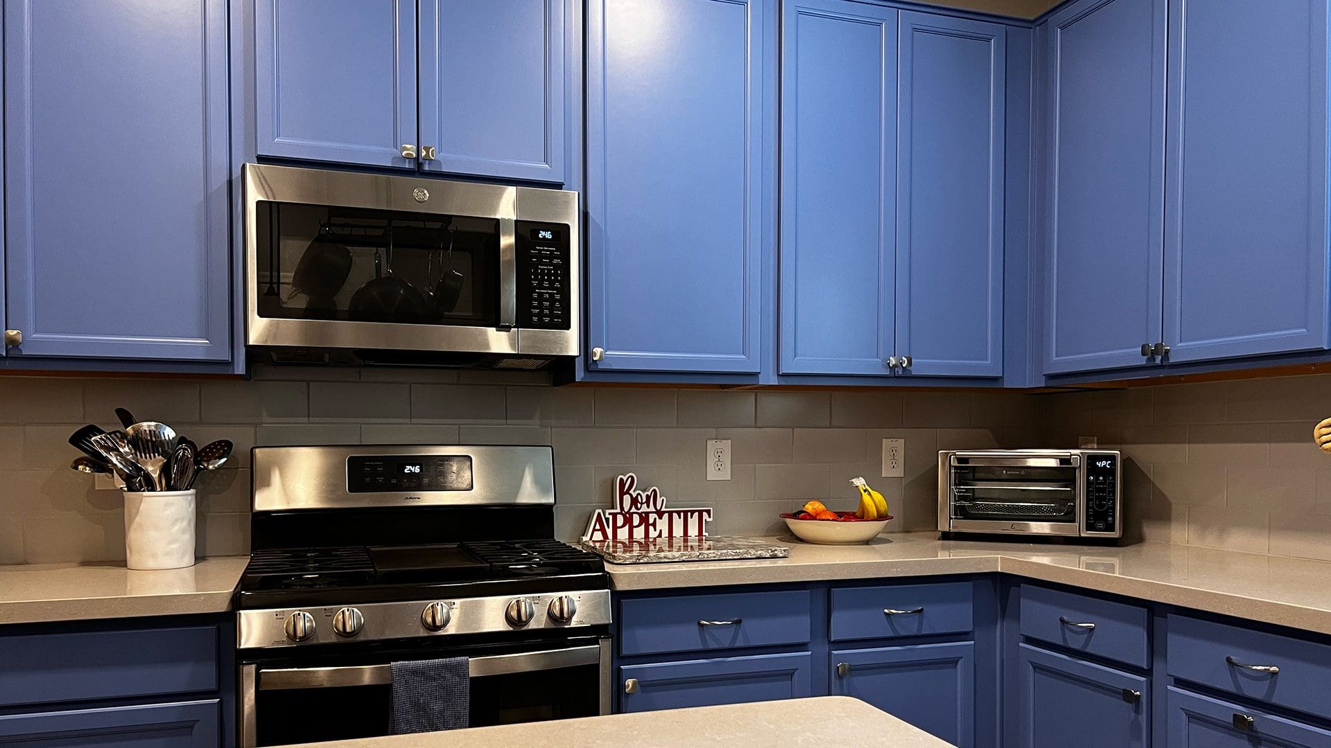 Kitchen with freshly painted blue cabinets